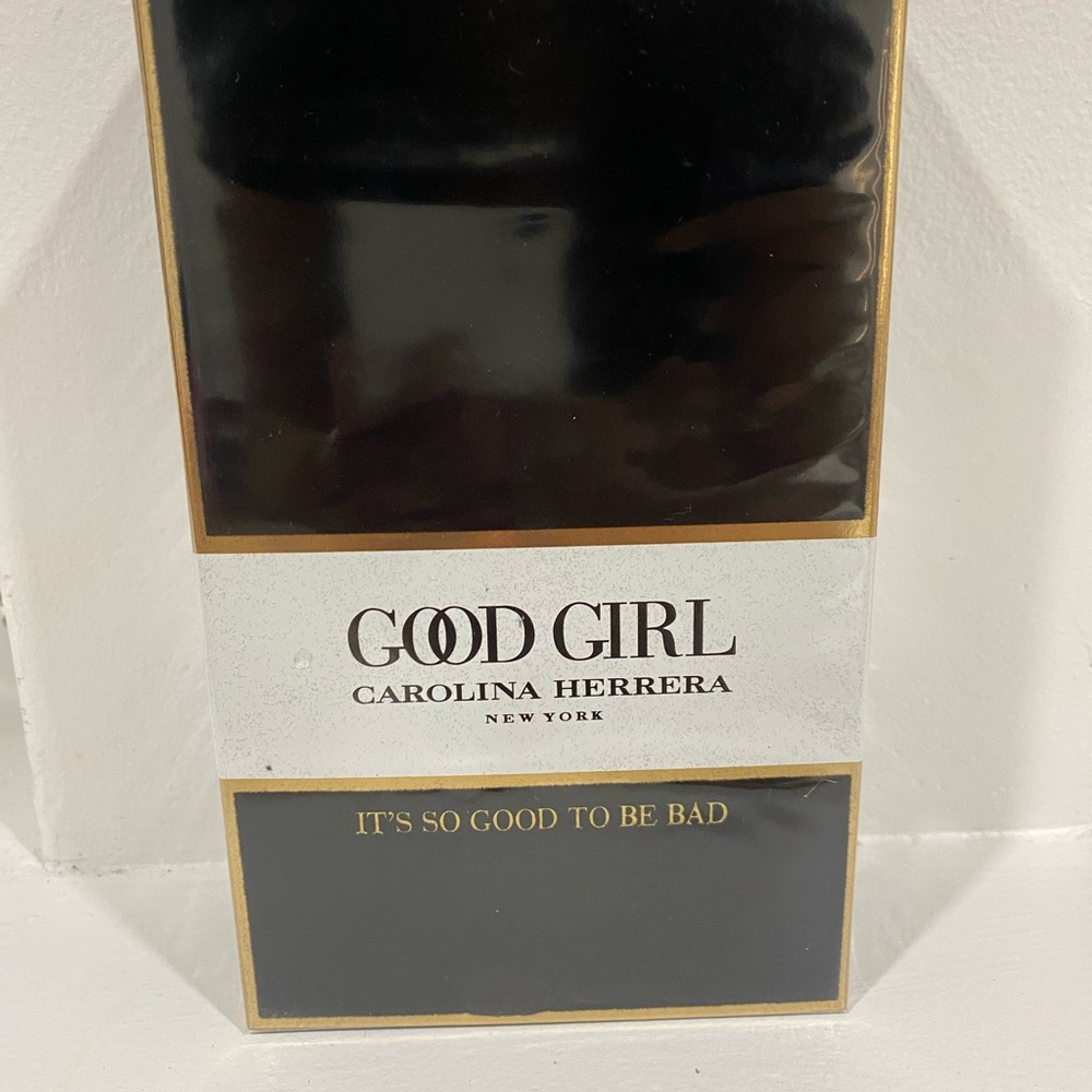 Carolina Herrera Fragrance Box with Black and Gold Accents
